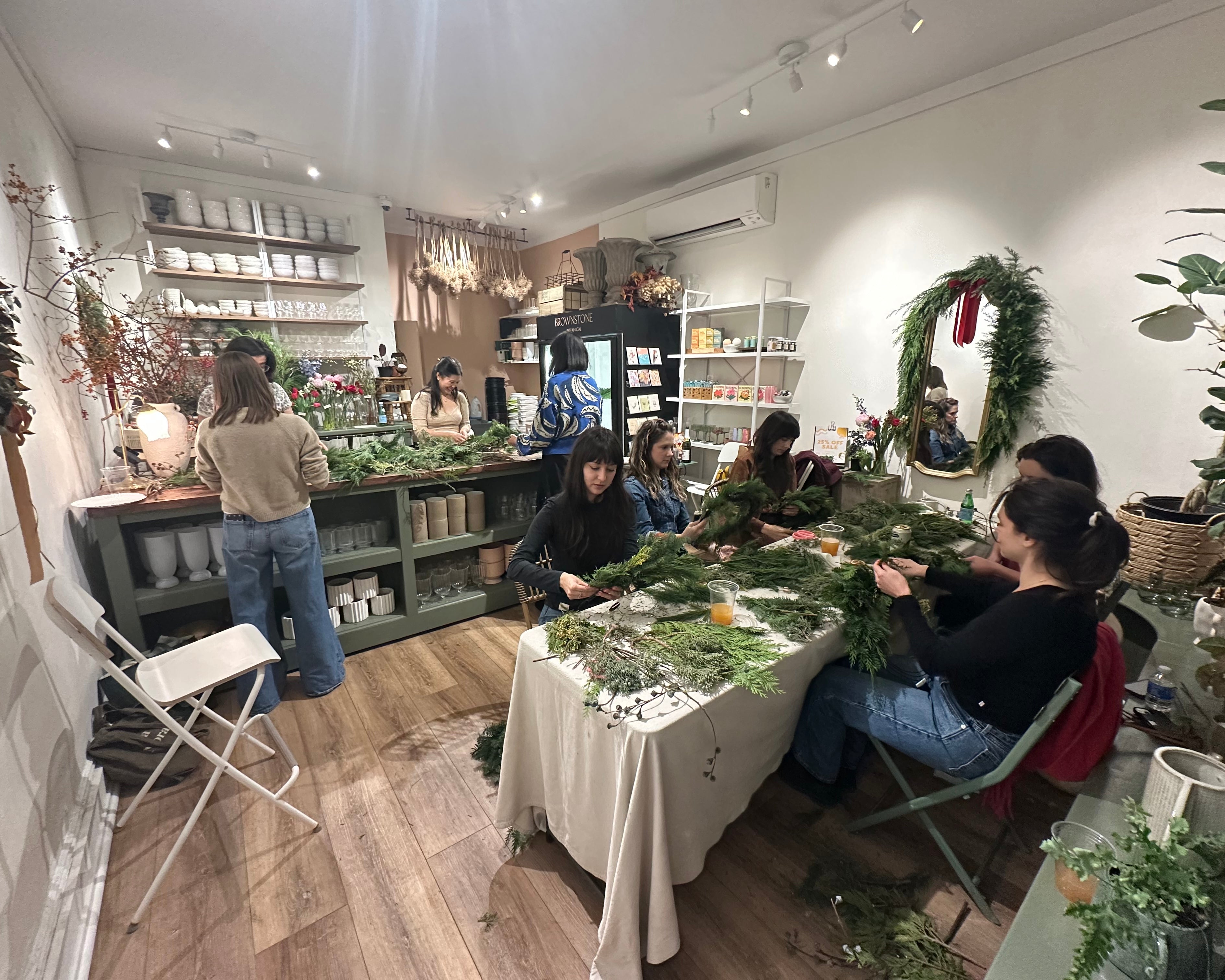 People shopping in a store with Christmas decorations