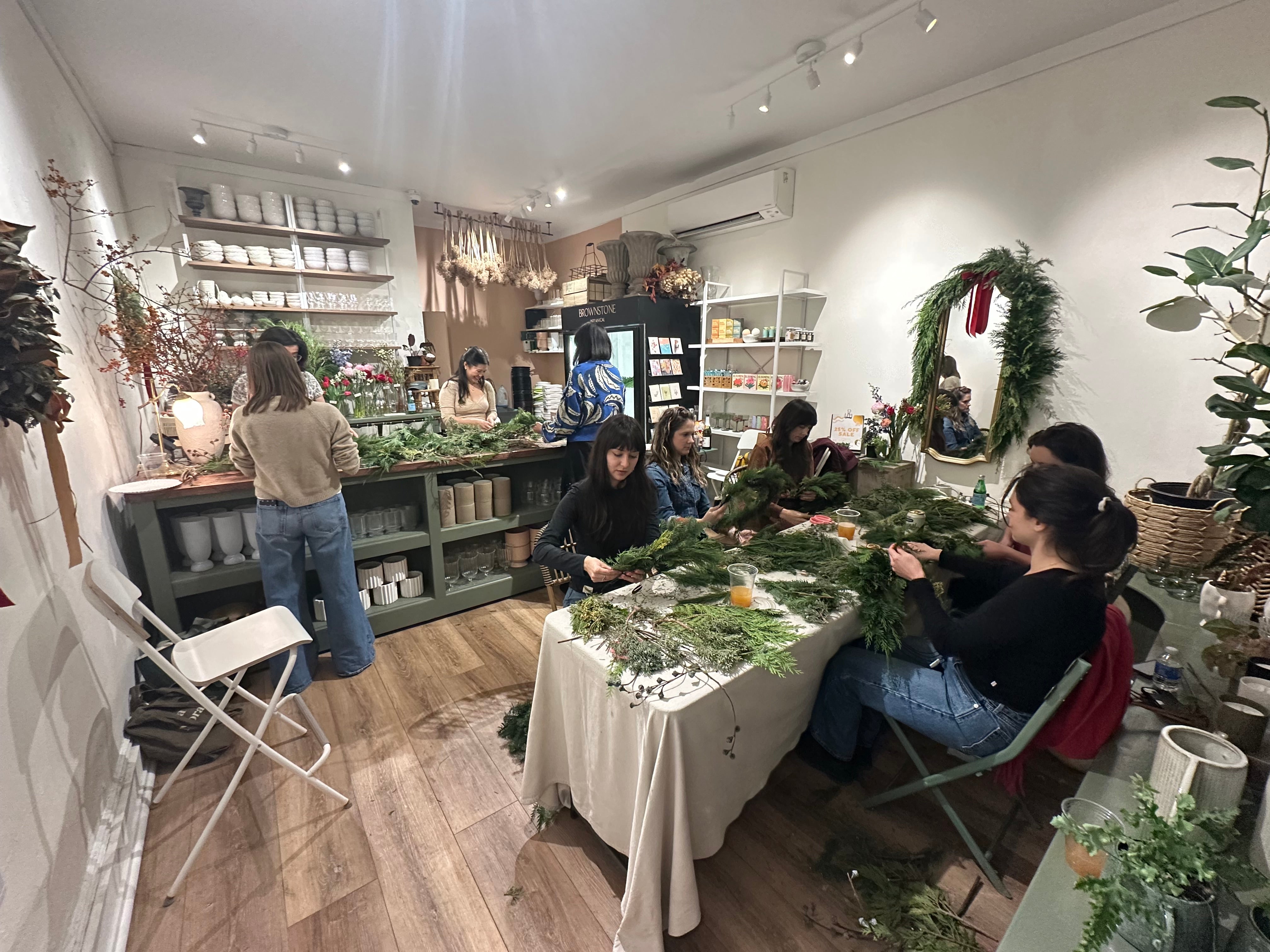 People shopping in a store with Christmas decorations